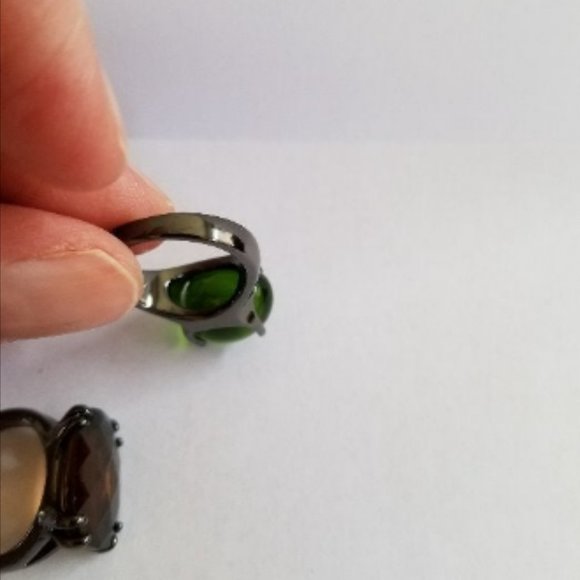 Jewelry Set Of Two Brown And Green Glass Stone Rings On Black Bands